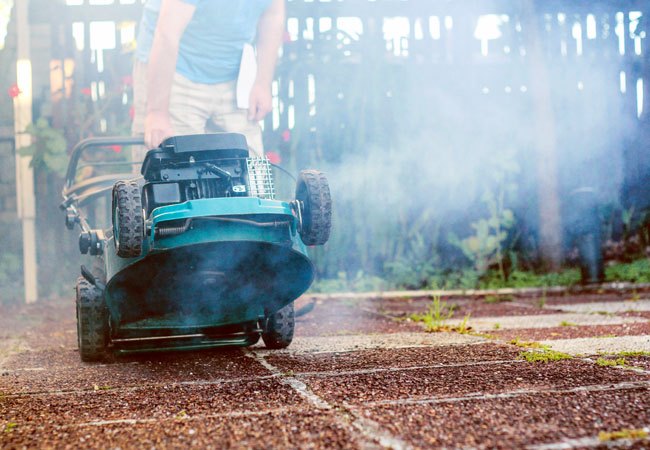 Why Is My Lawn Mower Smoking? Troubleshooting & Solutions